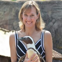 Image of Judy Mann holding a Penguin